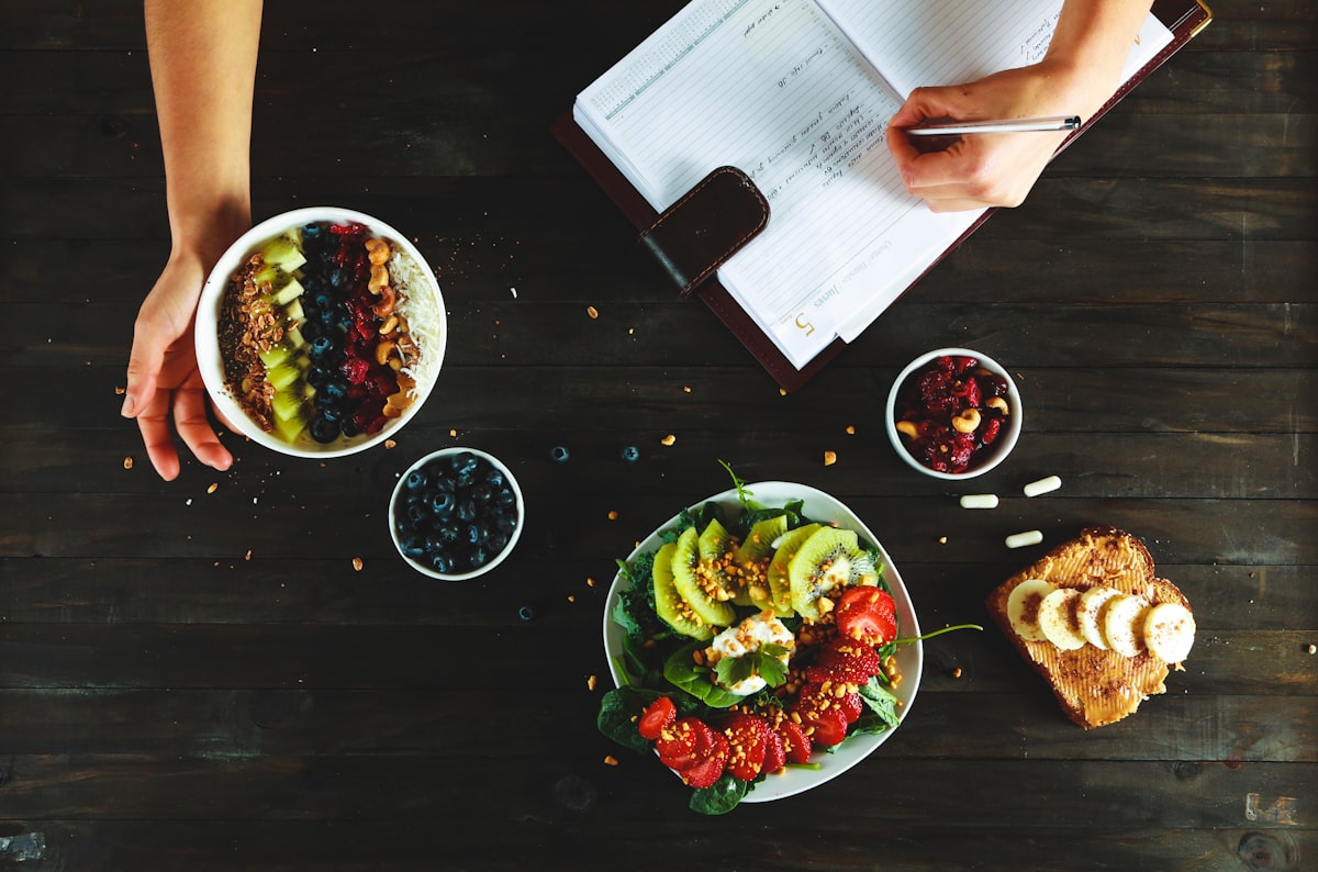 Nutritionist consultation workspace with fresh vegetables and wellness materials